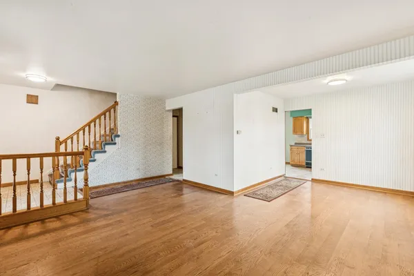 a kitchen with stainless steel appliances granite countertop a refrigerator and a stove