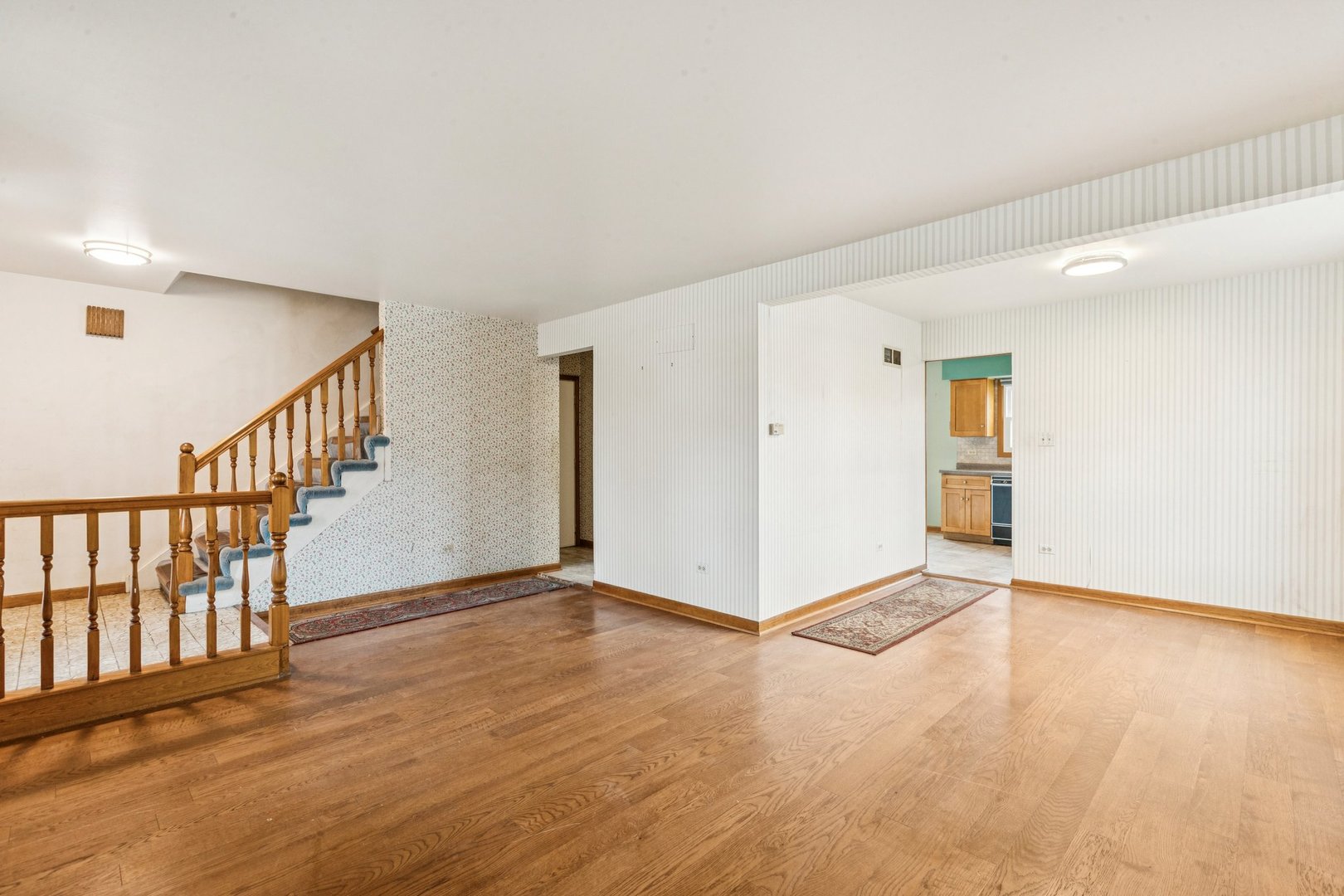 18604 Carpenter Street Homewood, IL 60430 - Photo 4 of 31 a view of an empty room with wooden floor