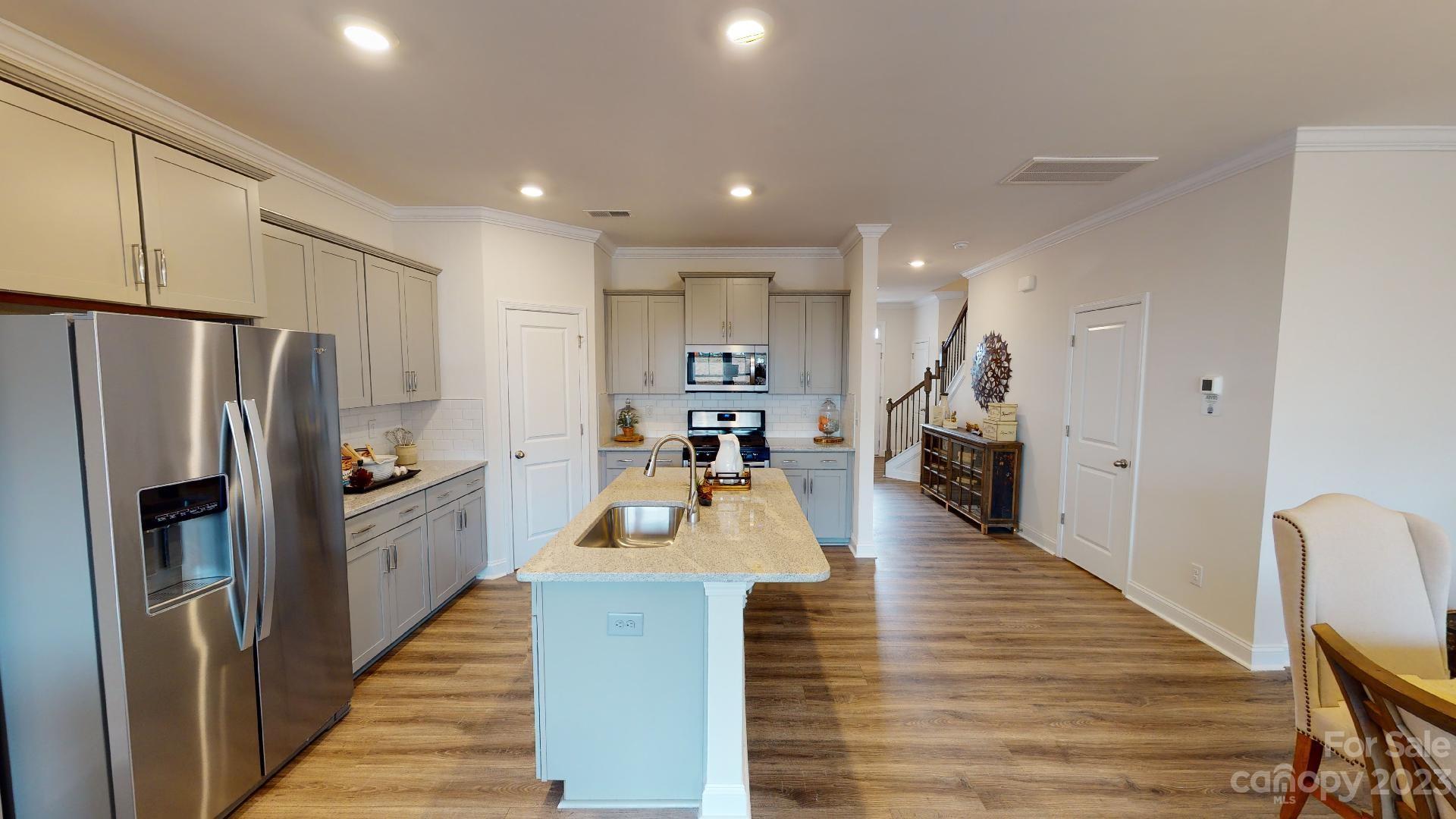 18 Ravens Rdg Road Hendersonville, NC 28792 - Photo 14 of 31 a large kitchen with white cabinets stainless steel appliances
