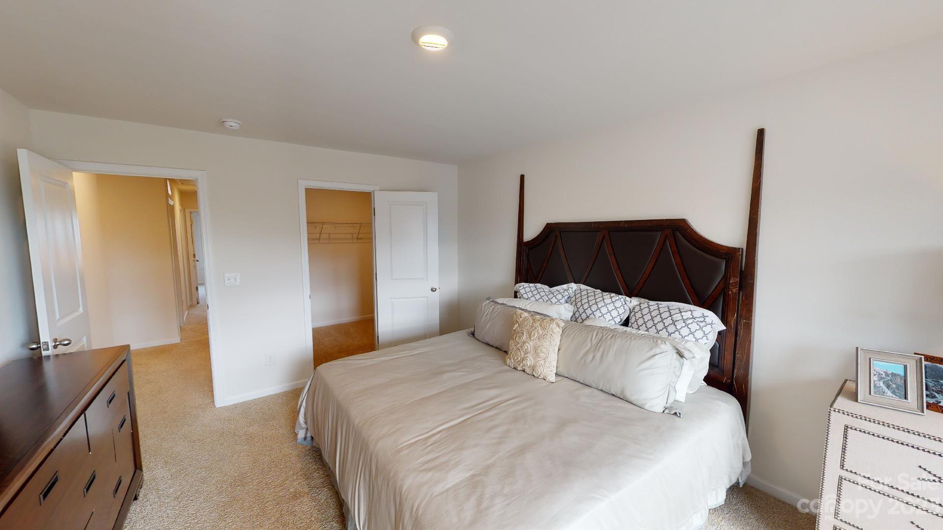 18 Ravens Rdg Road Hendersonville, NC 28792 - Photo 17 of 31 a bedroom with a bed and a night stand