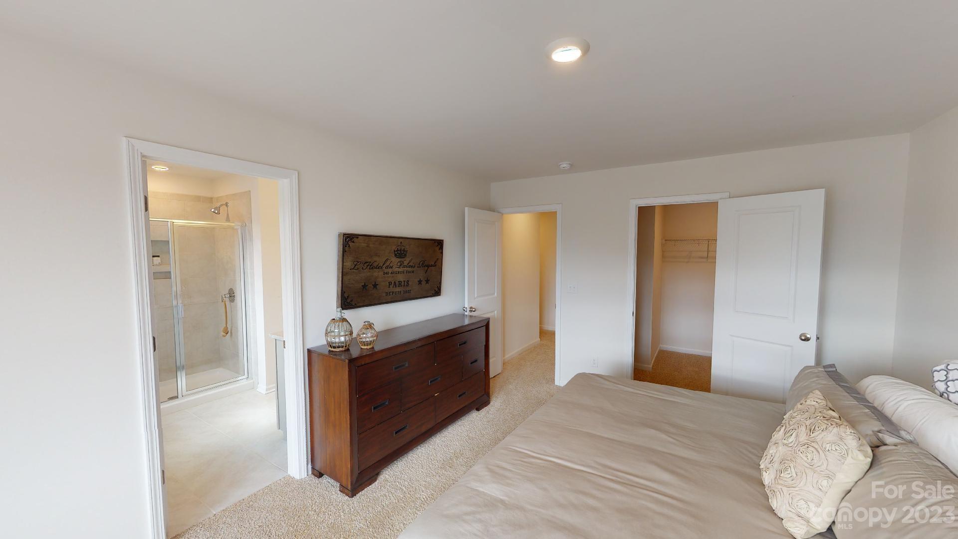 18 Ravens Rdg Road Hendersonville, NC 28792 - Photo 18 of 31 a bedroom with a bed and a television in it