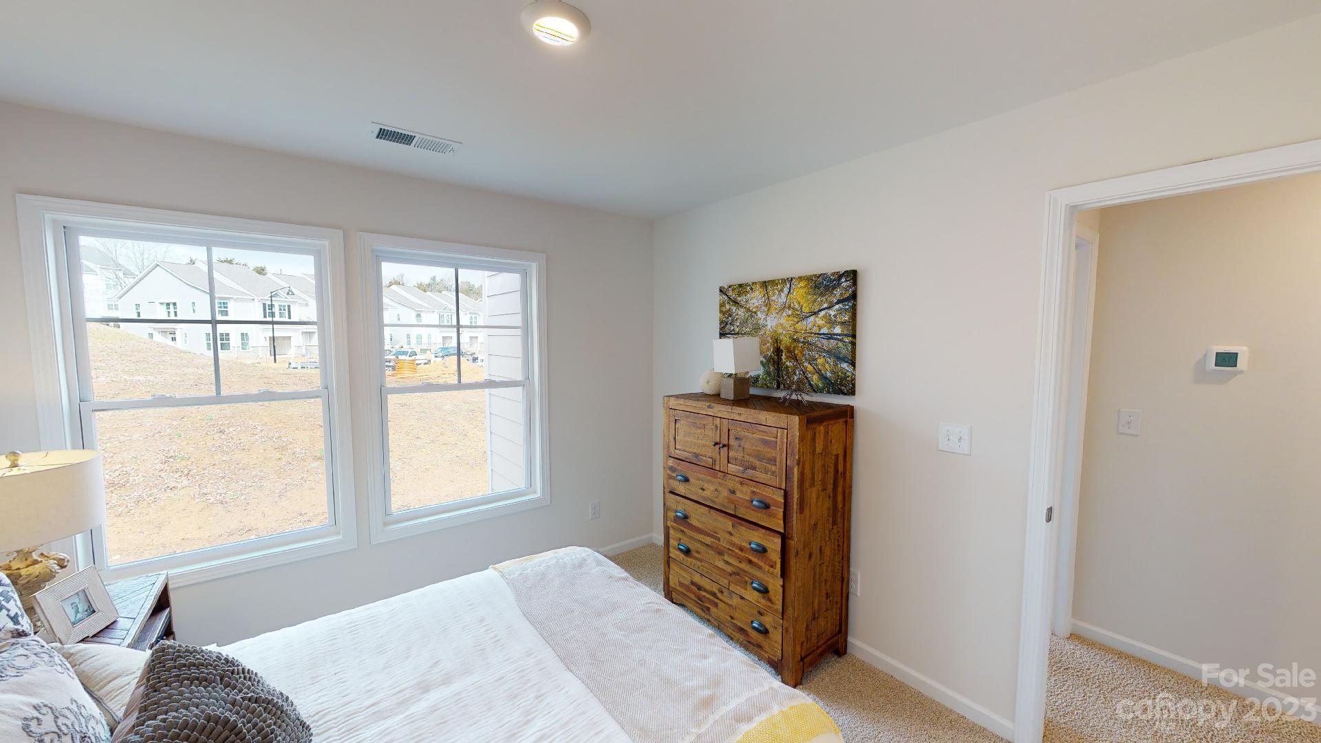 18 Ravens Rdg Road Hendersonville, NC 28792 - Photo 22 of 31 a bedroom with a bed and a window