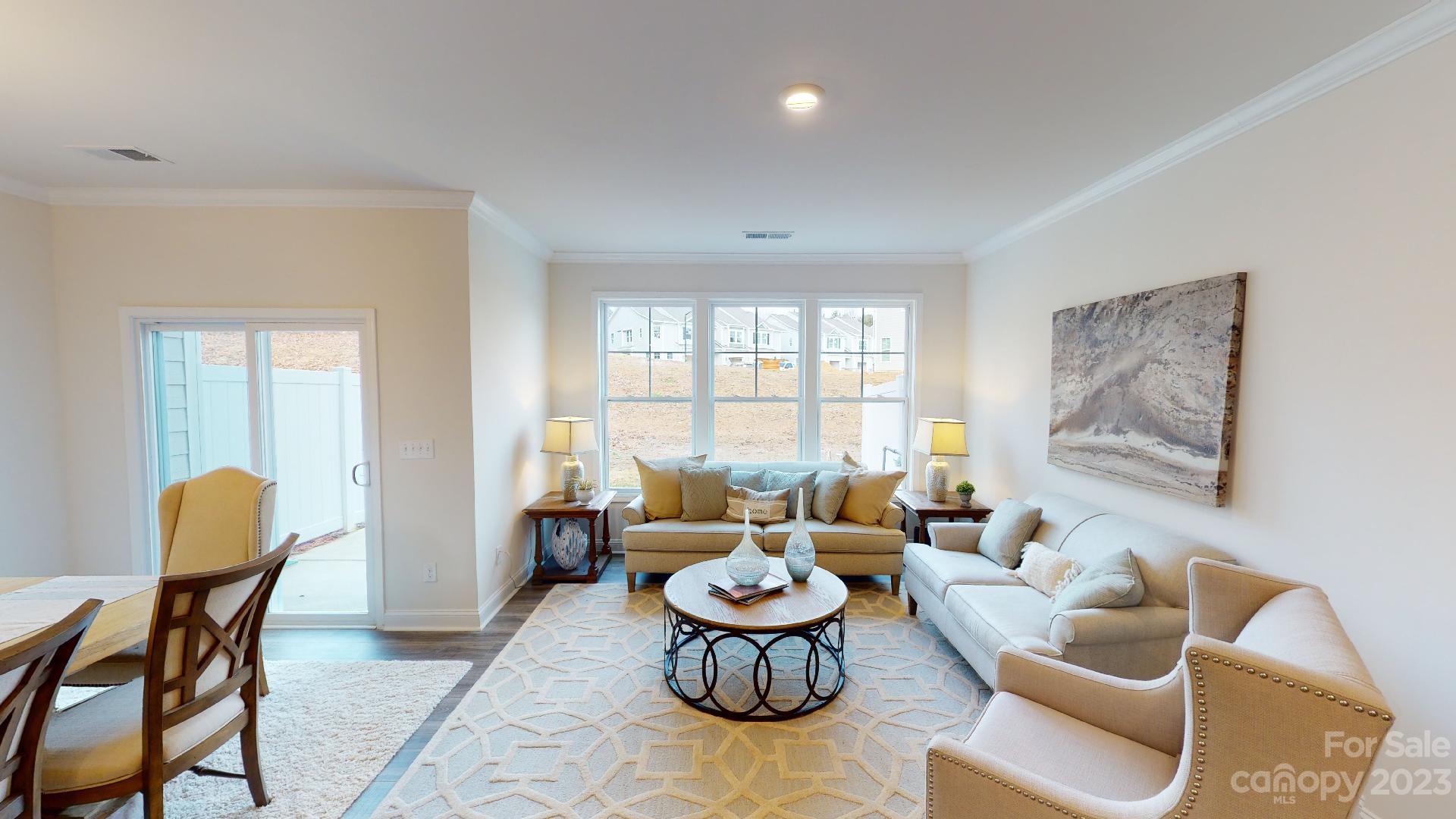 18 Ravens Rdg Road Hendersonville, NC 28792 - Photo 10 of 31 a living room with furniture and a large window