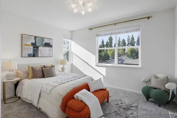 a bedroom with a bed and window