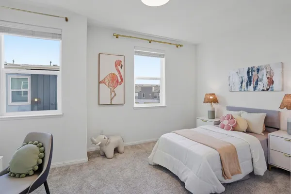a bedroom with a bed and cabinets