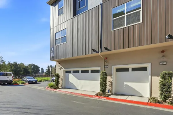 a front view of a building with parking