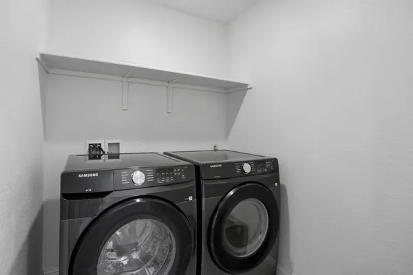 a utility room with dryer and washer