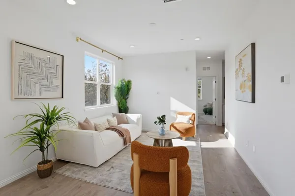 a living room with furniture and a large window