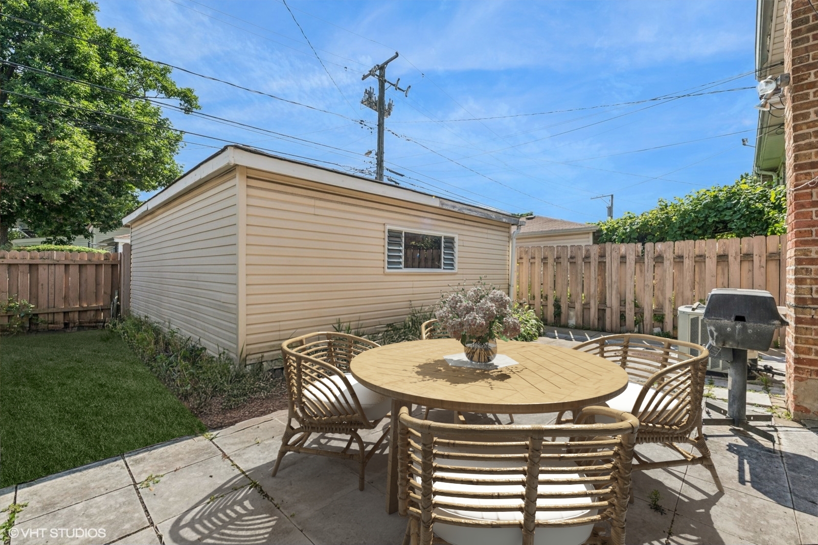 4143 West Devon Avenue Chicago, IL 60646 - Photo 17 of 22 a table and chairs in a patio