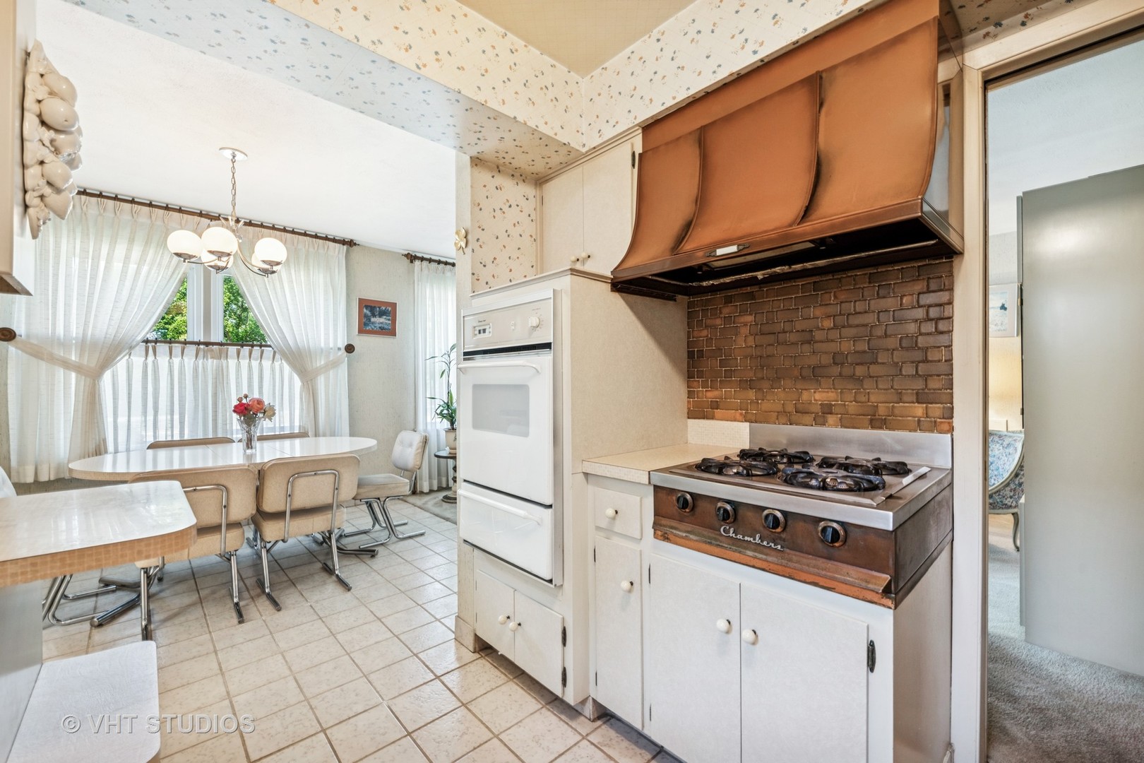 4143 West Devon Avenue Chicago, IL 60646 - Photo 7 of 22 a stove top oven sitting inside of a kitchen
