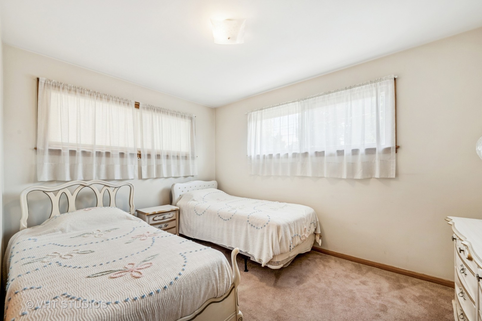4143 West Devon Avenue Chicago, IL 60646 - Photo 10 of 22 a bedroom with two beds and a large window