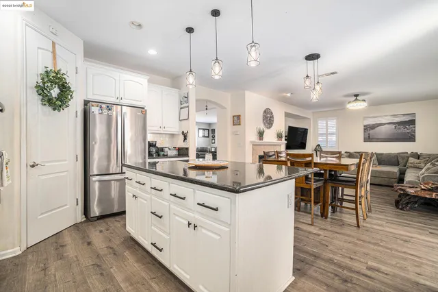 a view of a house with outdoor seating