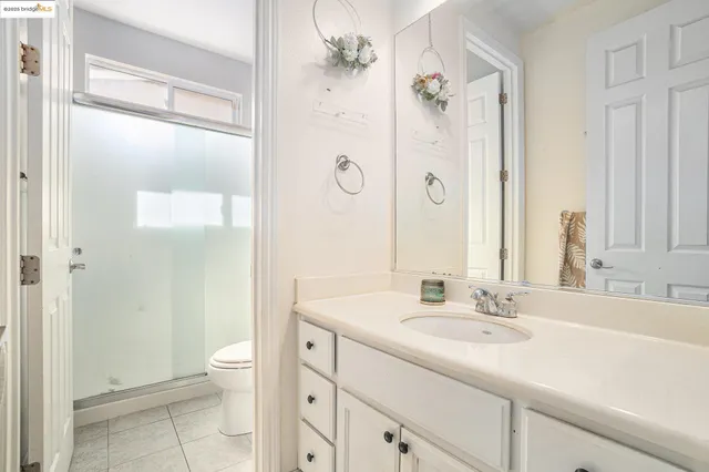 a bedroom with a bed and a table in it