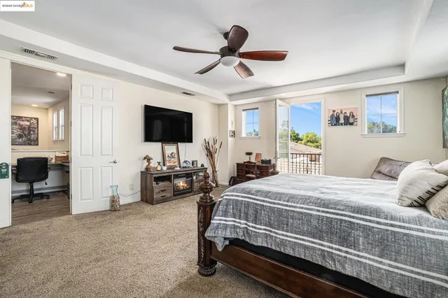 a bedroom with a bed and a couch