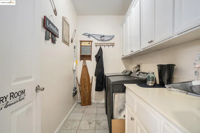 a white toilet sitting next to a bath tub