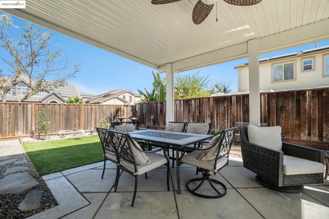 a kitchen with refrigerator and cabinets