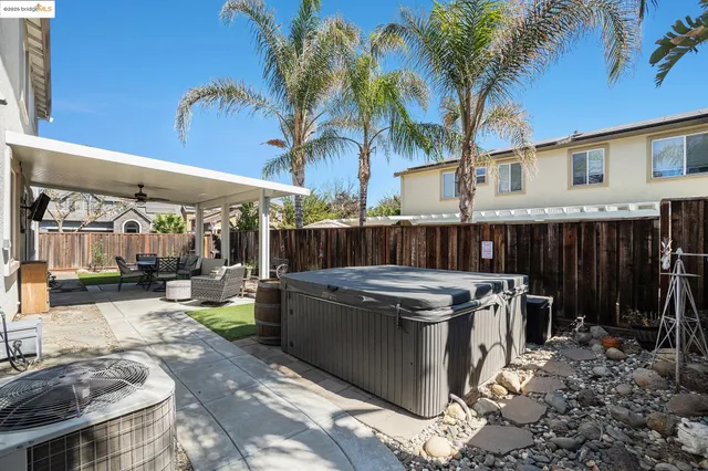 a view of a house with a yard patio and swimming pool