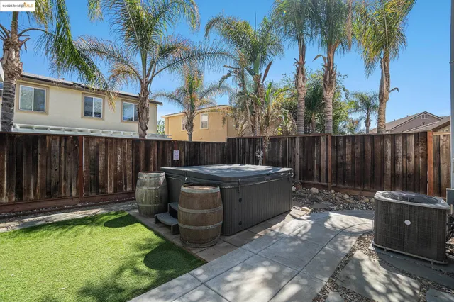 a view of a backyard with sitting area and furniture