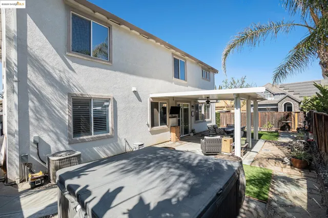 a view of a backyard with a tub