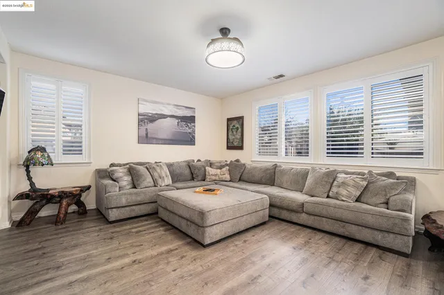 a living room with furniture and windows