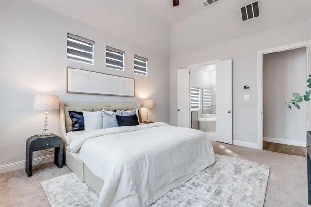 a bedroom with a bed and a chair