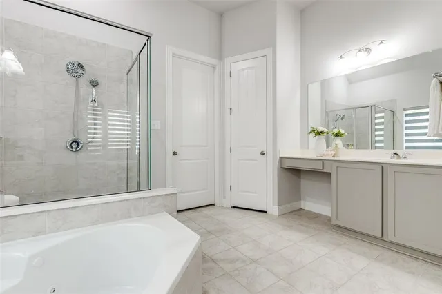 a bathroom with a bathtub and a shower