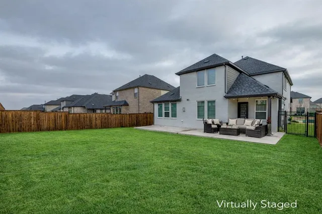 a front view of house with yard and seating area