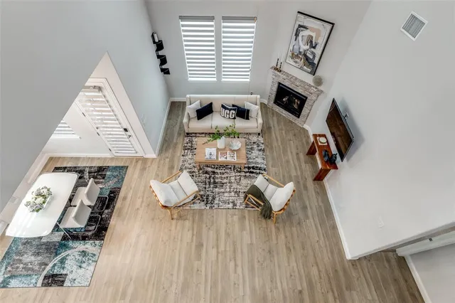 a view of living room with furniture and a fireplace