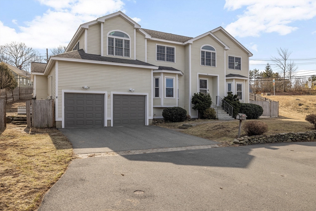 75 Cornell Road Marblehead, MA 01945 - Photo 2 of 26 a front view of a house with a yard