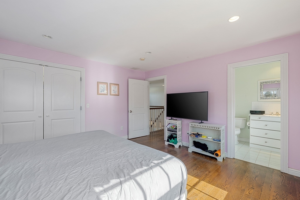 75 Cornell Road Marblehead, MA 01945 - Photo 22 of 26 a bedroom with a bed and a flat screen tv