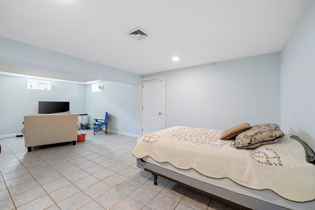 75 Cornell Road Marblehead, MA 01945 - Photo 24 of 26 a bedroom with a bed and a couch