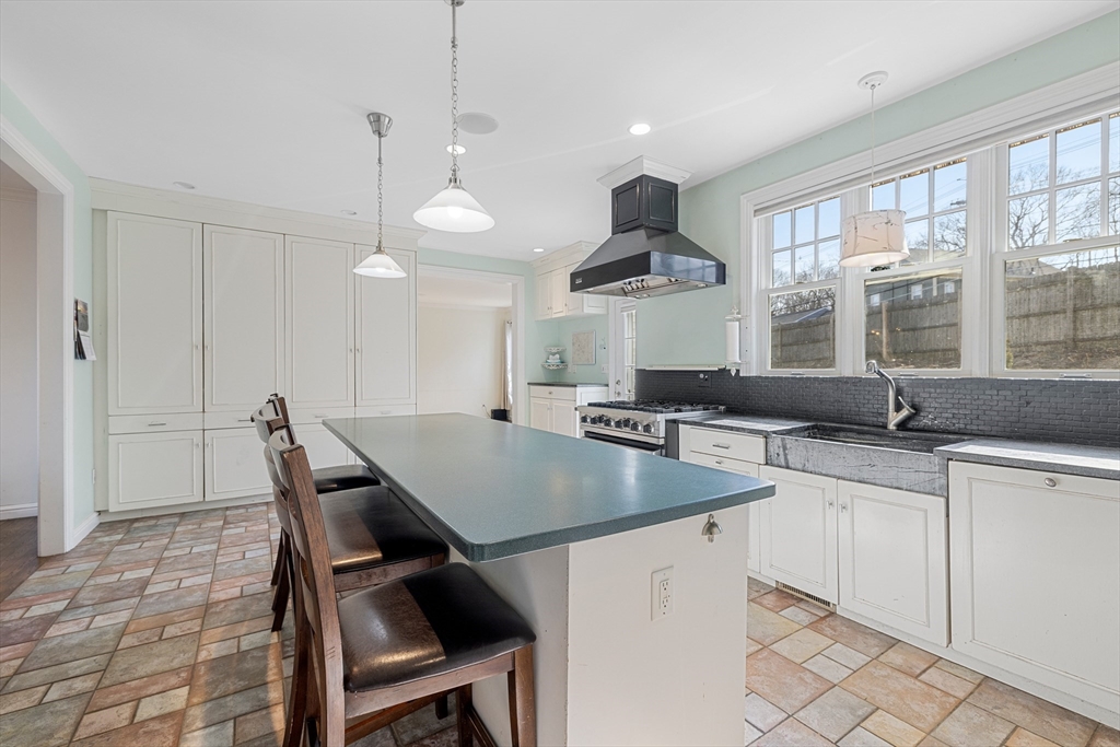 75 Cornell Road Marblehead, MA 01945 - Photo 8 of 26 a kitchen with a table chairs sink and wooden floor