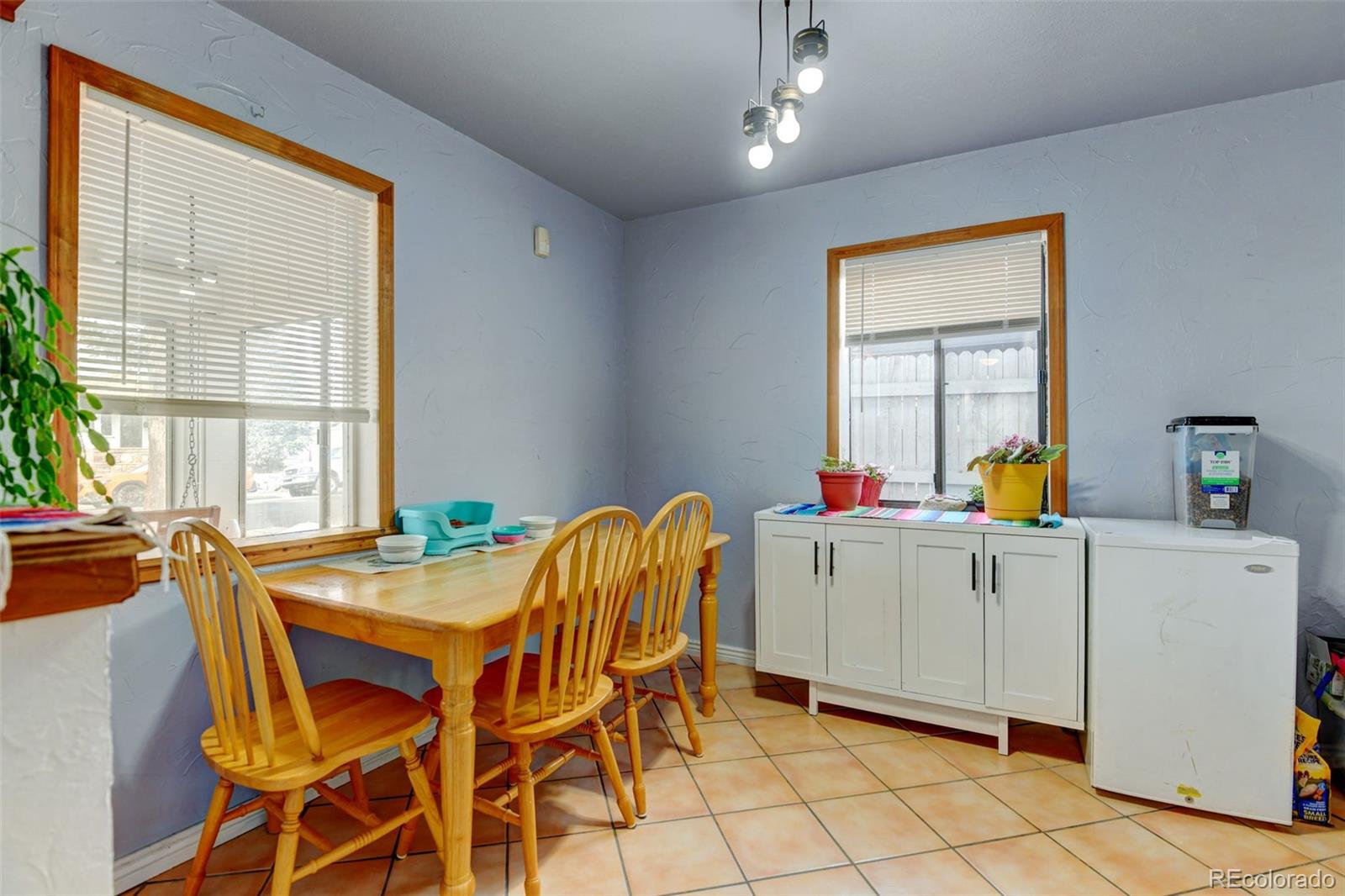 1256 Ulster Street Denver, CO 80220 - Photo 5 of 26 a dining room with furniture and window