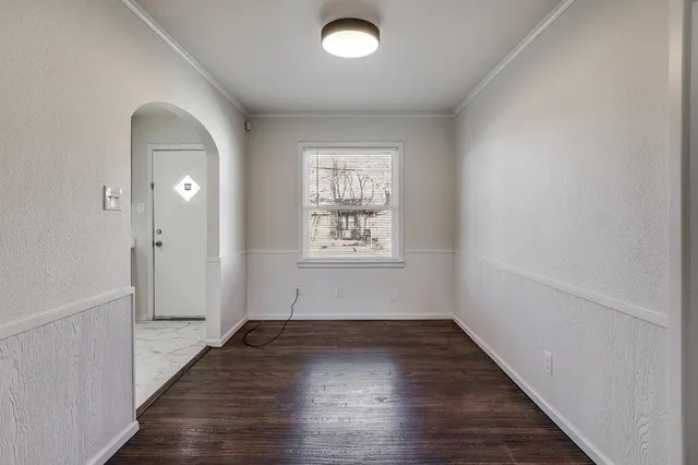 wooden floor in a room next to a window
