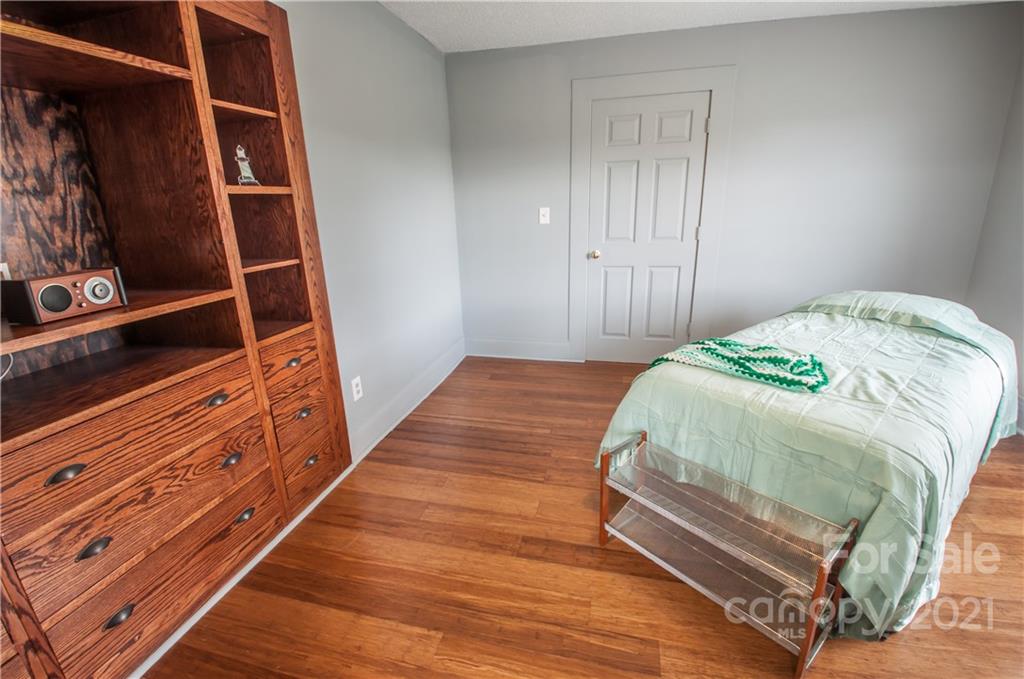 15655 Cool Springs Road Cleveland, NC 27013 - Photo 17 of 26 a bedroom with a bed and wooden floor