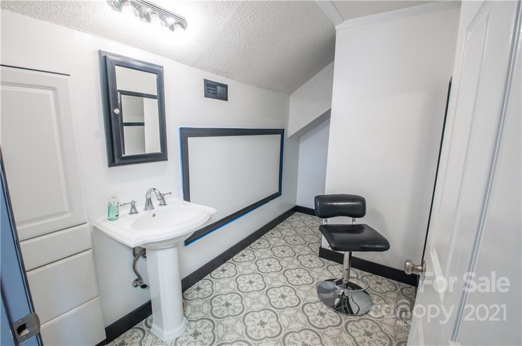 15655 Cool Springs Road Cleveland, NC 27013 - Photo 23 of 26 a bathroom with a sink toilet and mirror
