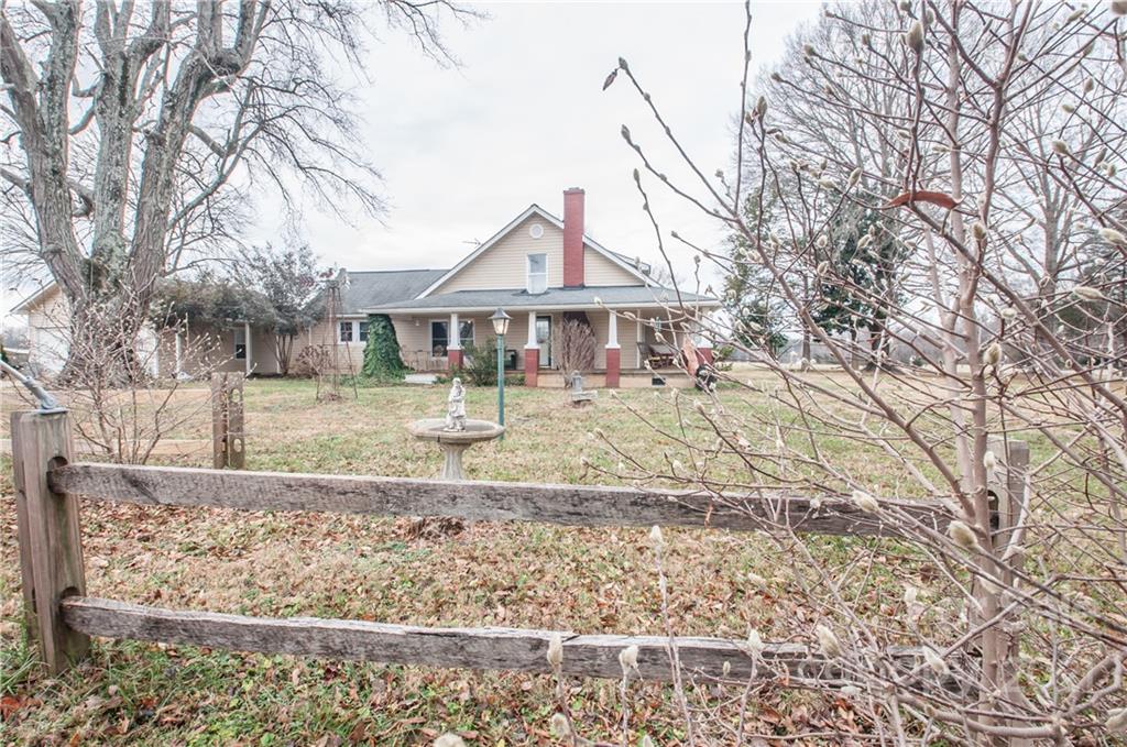 15655 Cool Springs Road Cleveland, NC 27013 - Photo 25 of 26 a front view of a house with garden