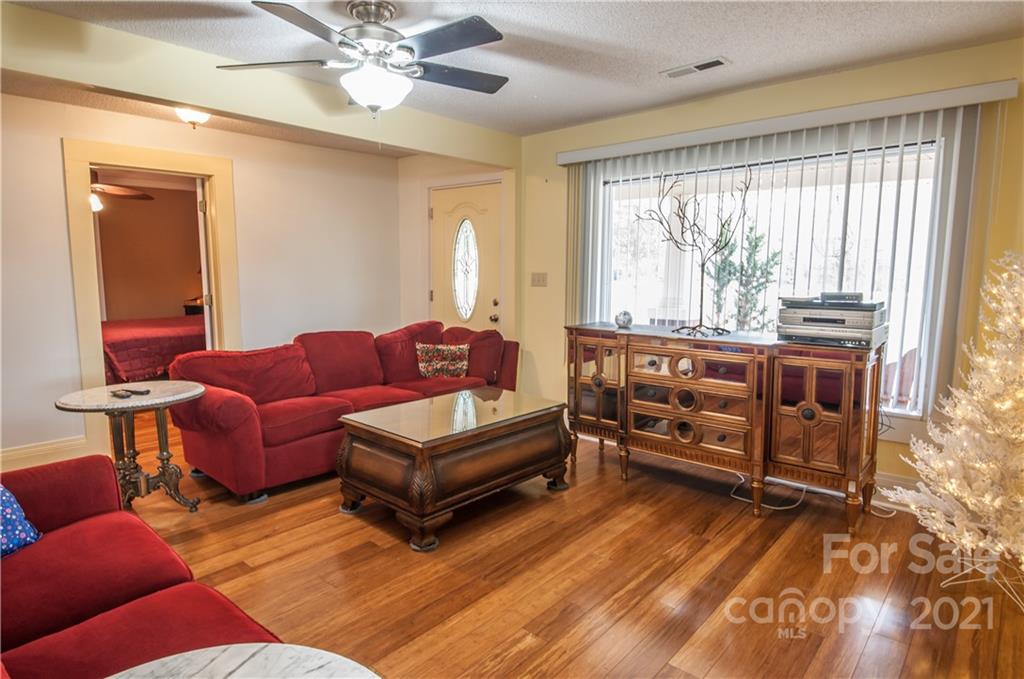 15655 Cool Springs Road Cleveland, NC 27013 - Photo 5 of 26 a living room with furniture and a large window