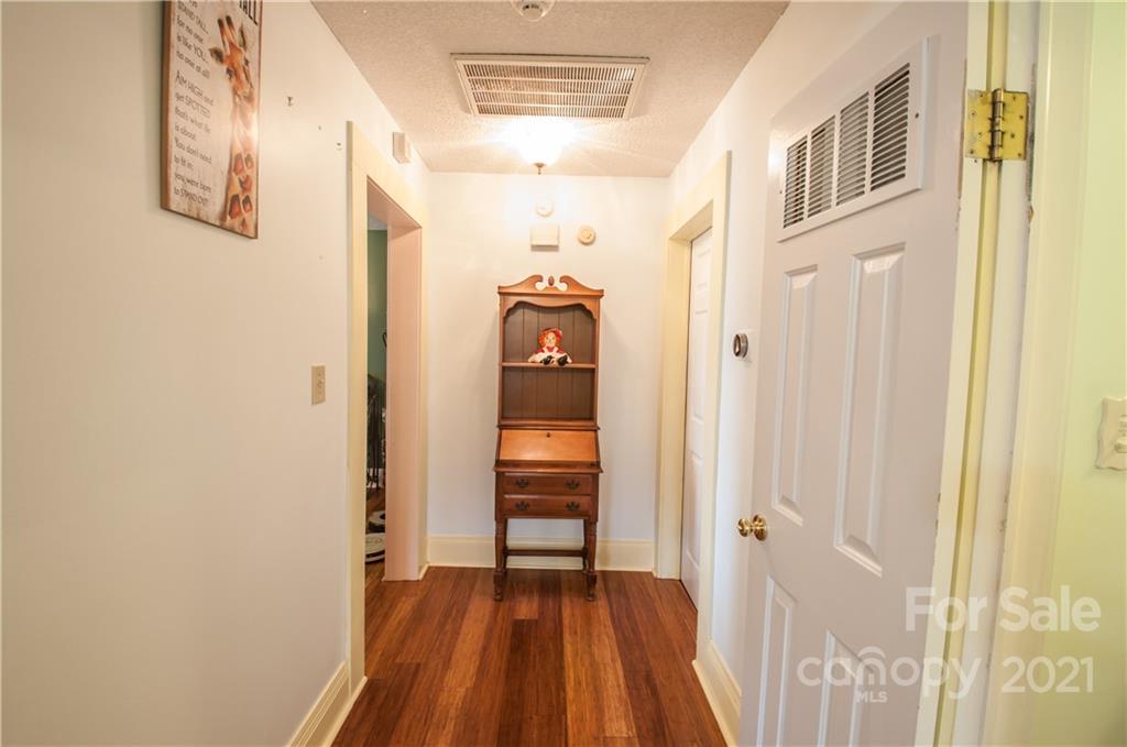 15655 Cool Springs Road Cleveland, NC 27013 - Photo 7 of 26 a view of a hallway with wooden floor and closet