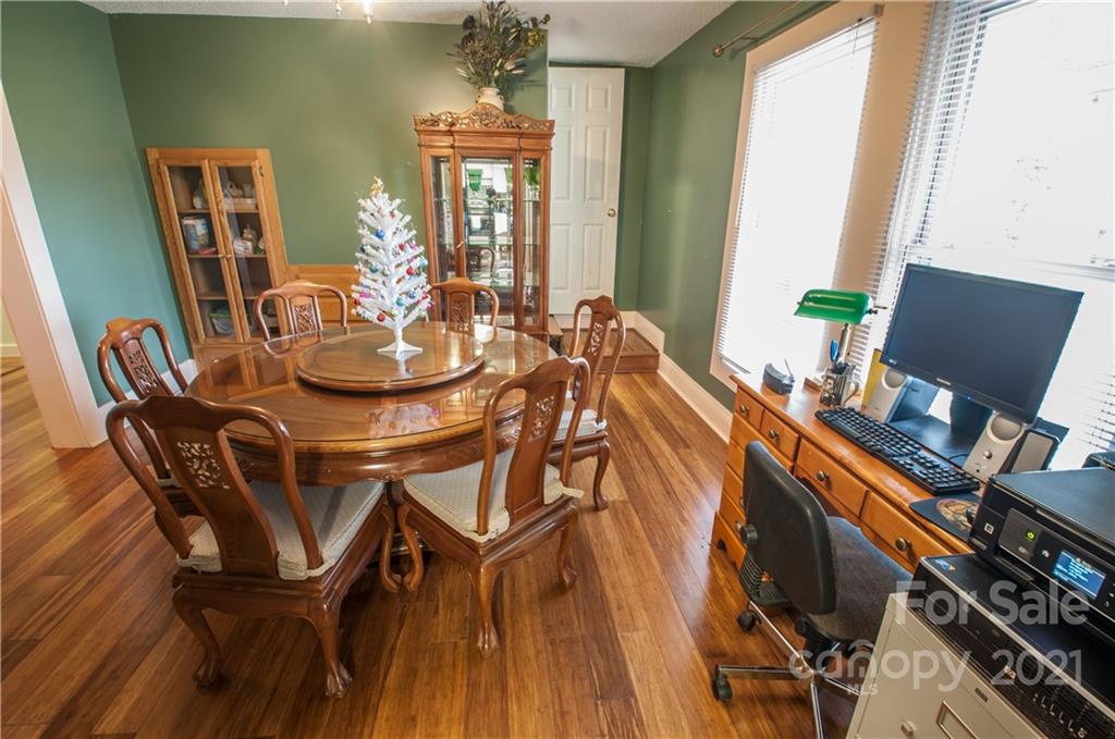 15655 Cool Springs Road Cleveland, NC 27013 - Photo 10 of 26 a view of a dining room with furniture and wooden floor
