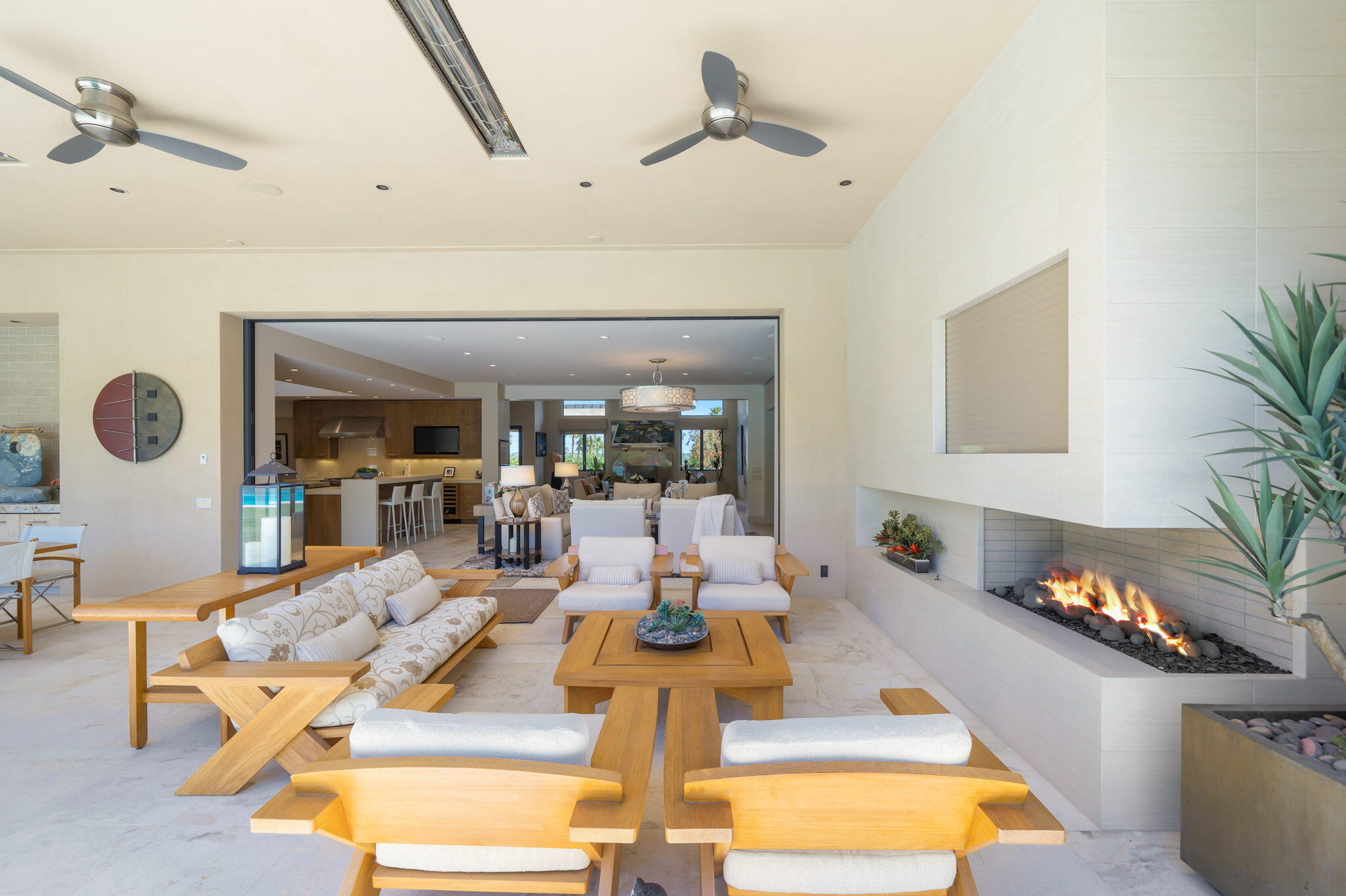 70345 Placerville Road Rancho Mirage, CA 92270 - Photo 101 of 116 a living room with fireplace furniture and a potted plant