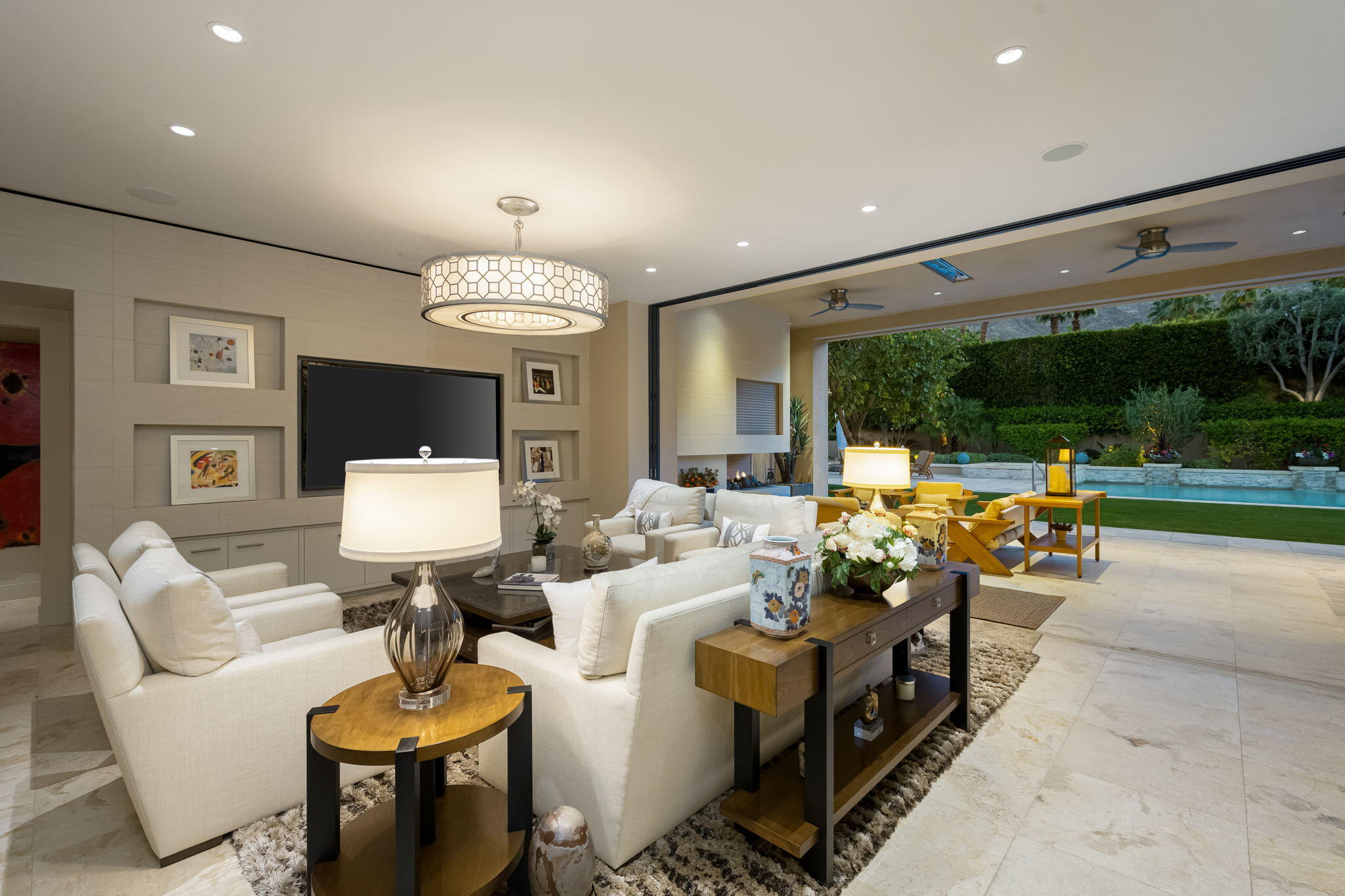 70345 Placerville Road Rancho Mirage, CA 92270 - Photo 27 of 116 a living room with furniture a rug and a chandelier