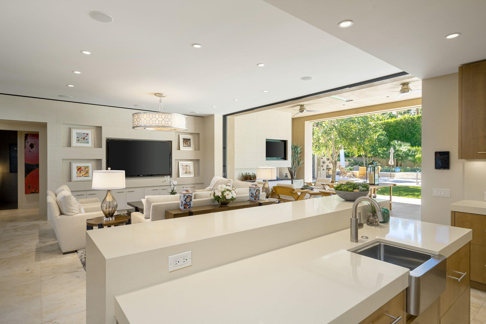 70345 Placerville Road Rancho Mirage, CA 92270 - Photo 28 of 116 a living room with stainless steel appliances furniture a flat screen tv and a large window