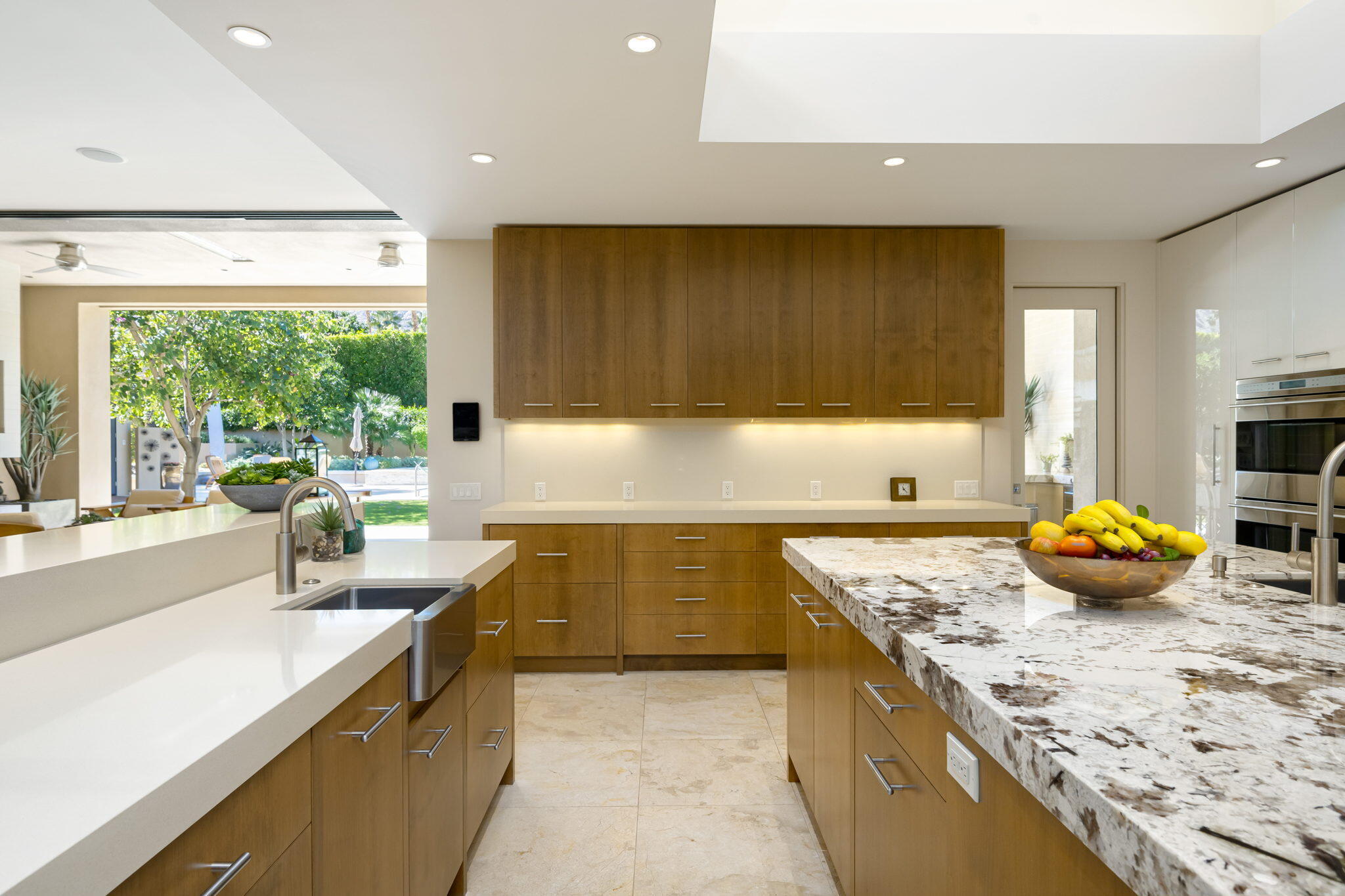 70345 Placerville Road Rancho Mirage, CA 92270 - Photo 29 of 116 a kitchen with stainless steel appliances granite countertop a sink stove and cabinets
