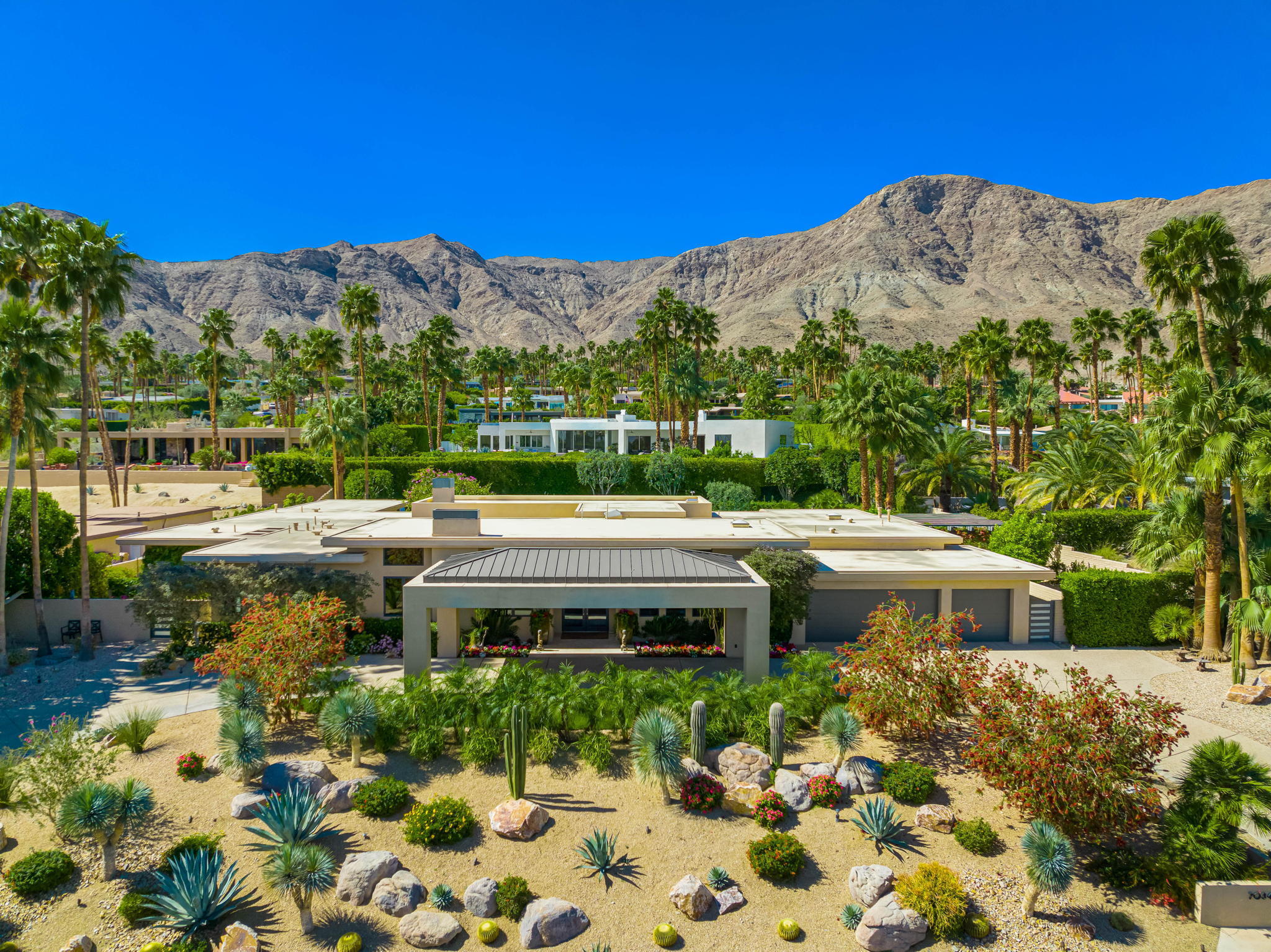 70345 Placerville Road Rancho Mirage, CA 92270 - Photo 8 of 116 a view of a yard with plants and a bench
