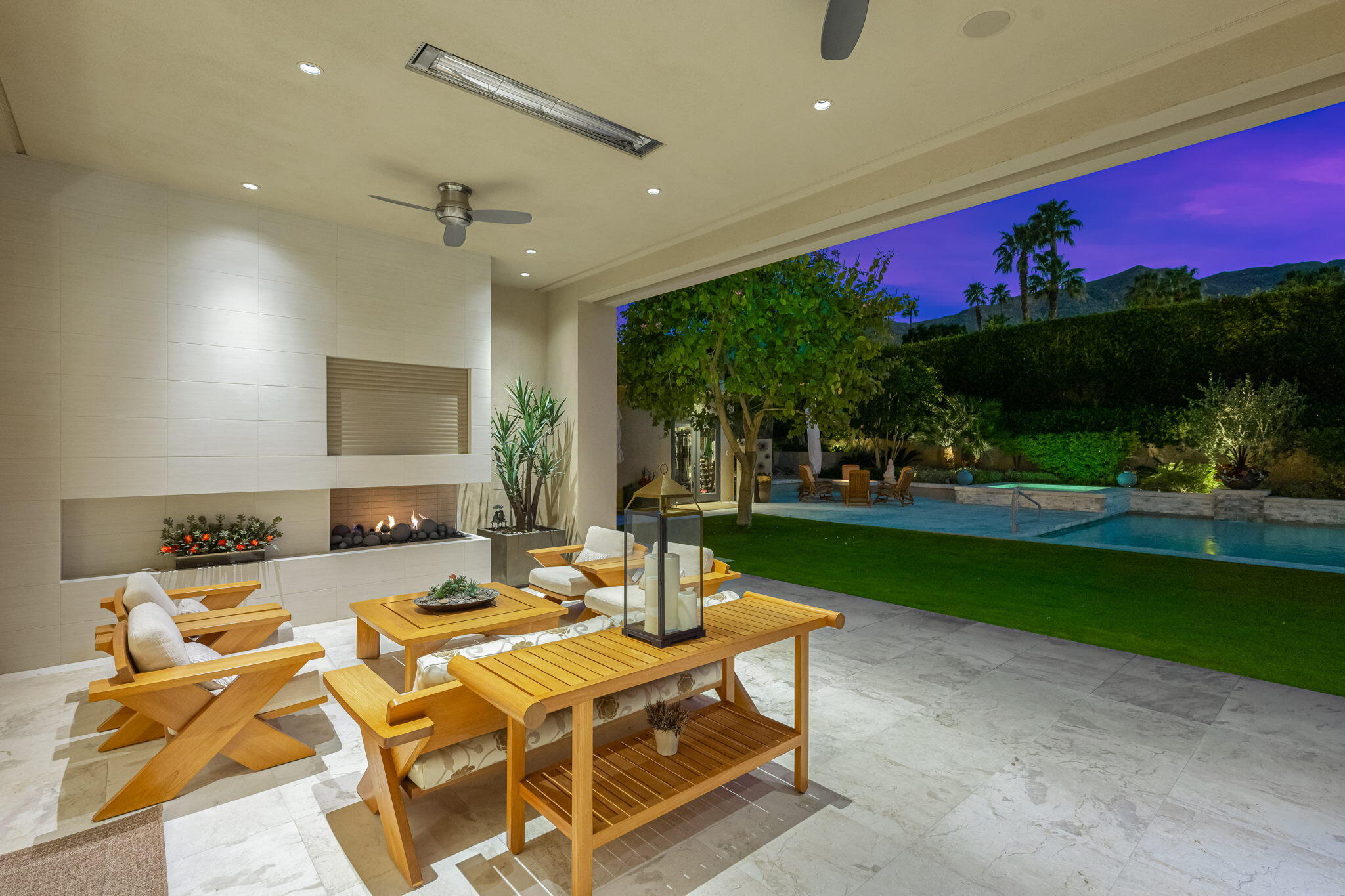 70345 Placerville Road Rancho Mirage, CA 92270 - Photo 81 of 116 a view of a patio with dining table and chairs with a fire pit