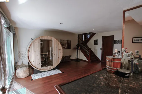 a view of an entryway with wooden floor