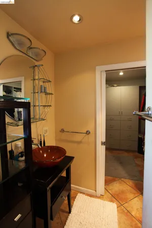 a view of a bathroom with a sink and mirror