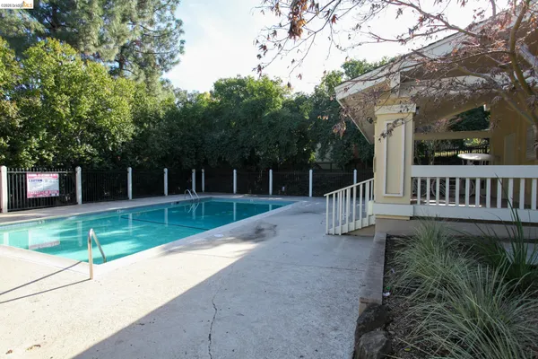 a view of house with a yard