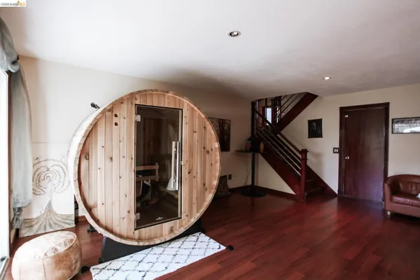 a view of an entryway with wooden floor
